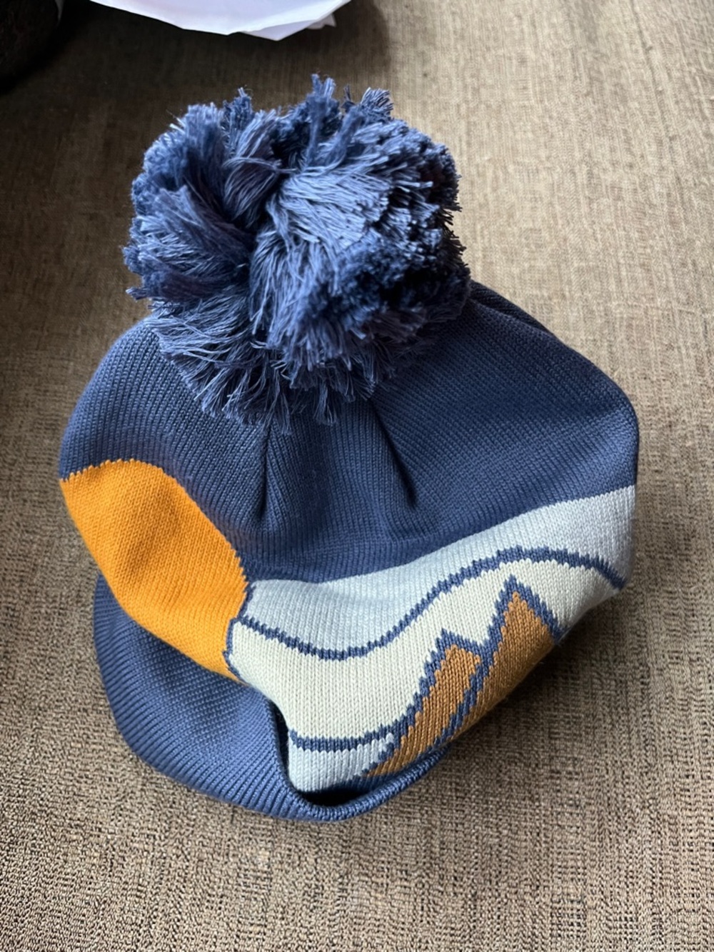 Marmot Navy Pom Knit Beanie with Yellow & Cream Mountain Design - Picture 4 of 6